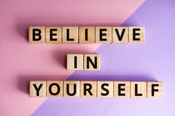 istock phrase believe in yourself, wooden cubes 1158025954