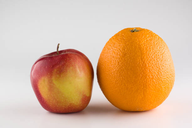 istock ripe beautiful apple with orange 1158027278
