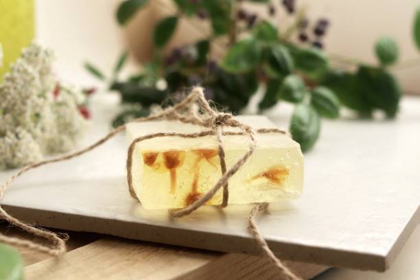 istock Natural soap,  plants and berries on a wooden table 1158029857