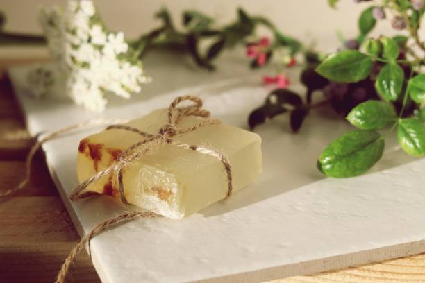 istock Natural soap,  plants and berries on a wooden table 1158029889