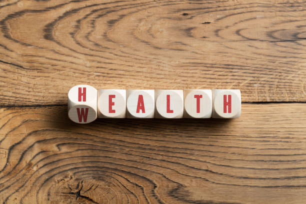 istock Letters on blocks spelling wealth or health 1158032580
