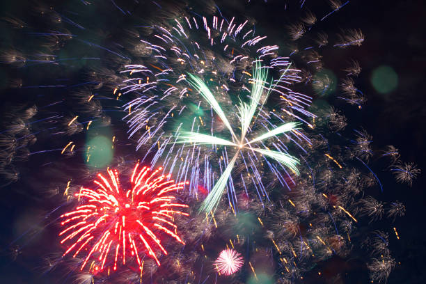 istock Colorful Firework display background at night for celebration anniversary . Great holiday of a great country. The celebration of Independence Day in the United States of America. 4th of July. 1158032781