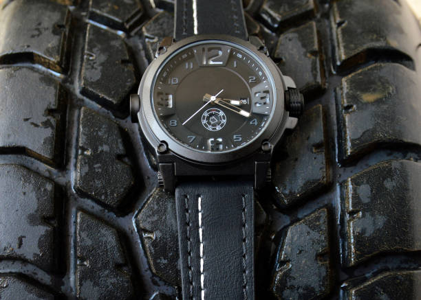 istock Black sport watch and tire car 1158032981