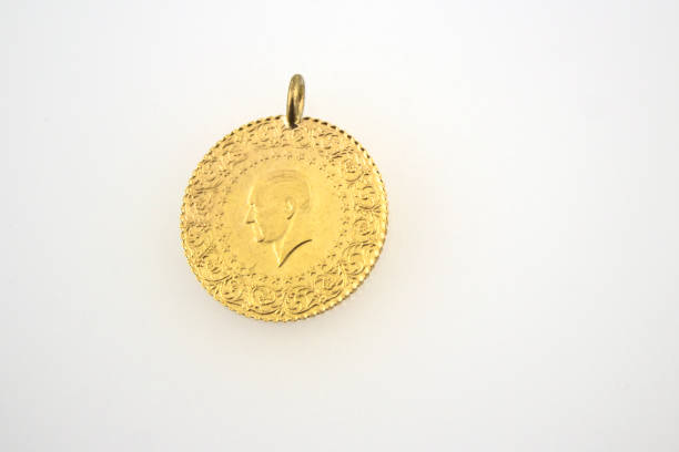 istock gold on the white background 1158033173