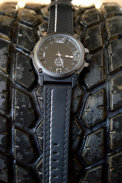 istock Black sport watch and tire car 1158033347
