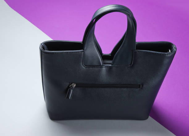 istock Leather bag on gray-purple background. 1158033492