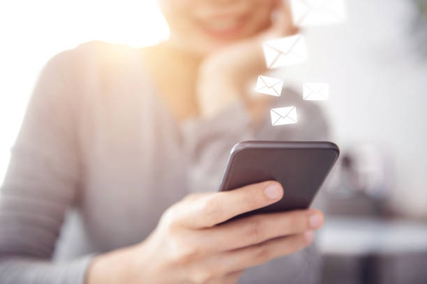 istock Closeup happy woman hand using mobile smartphone with email icon, Email concept. 1158034283