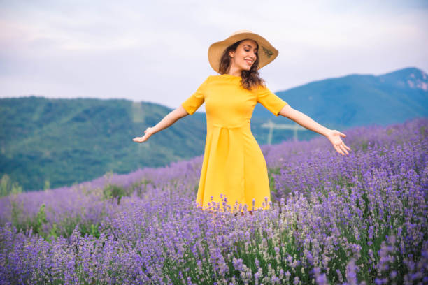 istock Woman enjoying lavender fields 1158034543