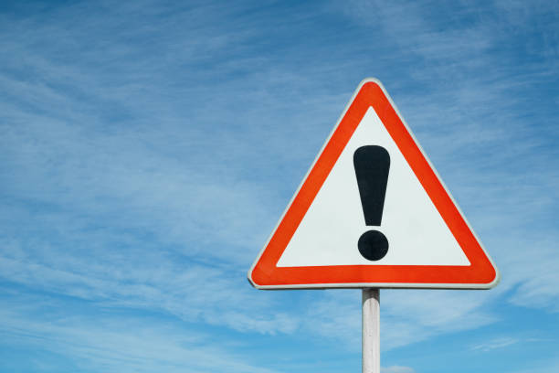 istock Exclamation point of attention against the sky. 1158035429