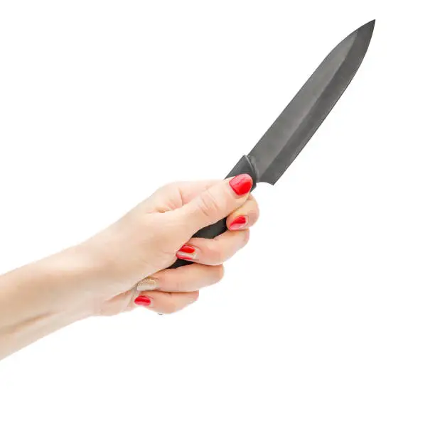 Photo of Woman hand holding kitchen knife. Isolated on white background.