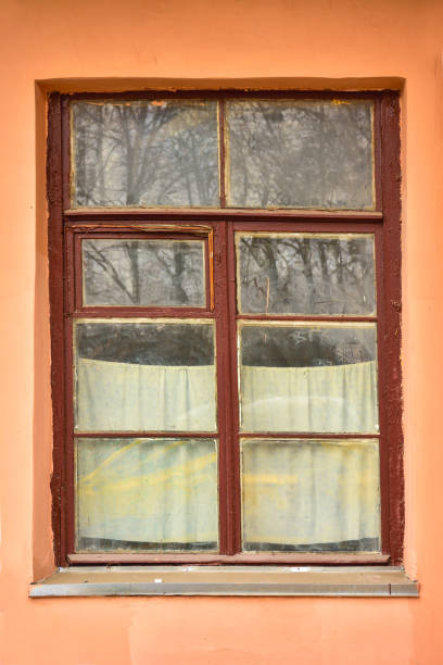 istock wooden window with brown frame in window, old window 1158037289