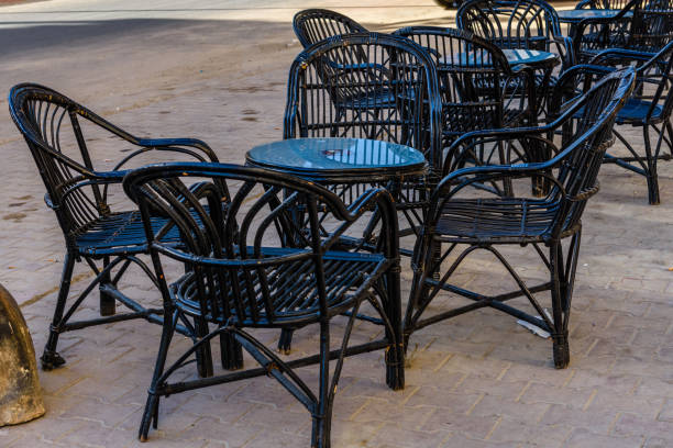 istock Empty tables and chairs in a street cafe 1158038255
