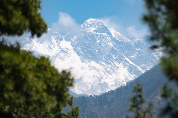 100 MPix XXXXL size panorama of Mount Ama Dablam - probably the most beautiful peak in Himalayas. \n This panoramic landscape is an very high resolution multi-frame composite and is suitable for large scale printing\nAma Dablam is a mountain in the Himalaya range of eastern Nepal. The main peak is 6,812  metres, the lower western peak is 5,563 metres. Ama Dablam means  'Mother's neclace'; the long ridges on each side like the arms of a mother (ama) protecting  her child, and the hanging glacier thought of as the dablam, the traditional double-pendant  containing pictures of the gods, worn by Sherpa women. For several days, Ama Dablam dominates  the eastern sky for anyone trekking to Mount Everest basecamp