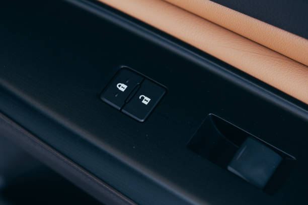 istock Front and back electric windows buttons-lower or close car windows. Leather upholstery, chrome and silver ornaments. Adjustable folding mirrors left and right. 1158040172