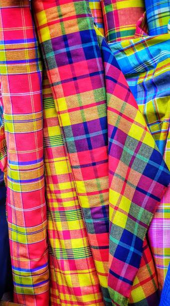 istock Rolls of vertical fabrics with different original Scottish patterns. Tissue market. 1158041878