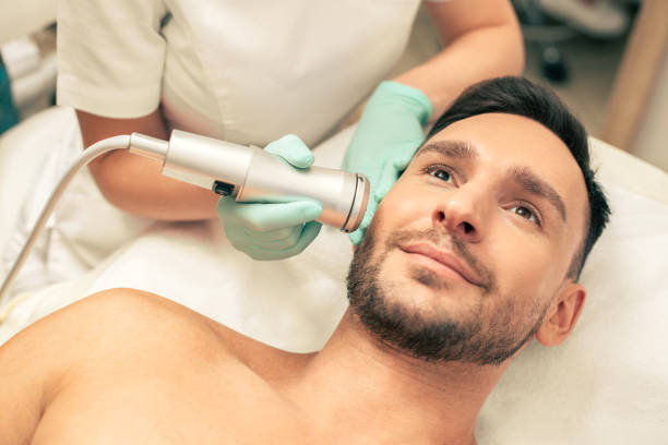istock Young smiling man enjoying painless oxygen meso therapy 1158046098