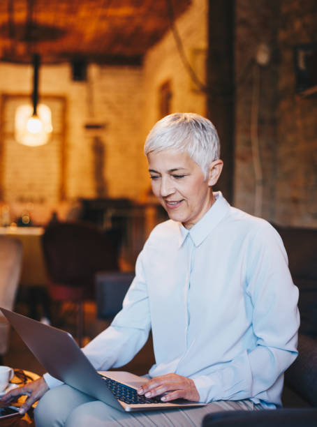 istock Woman working on laptop at cafe 1158046626