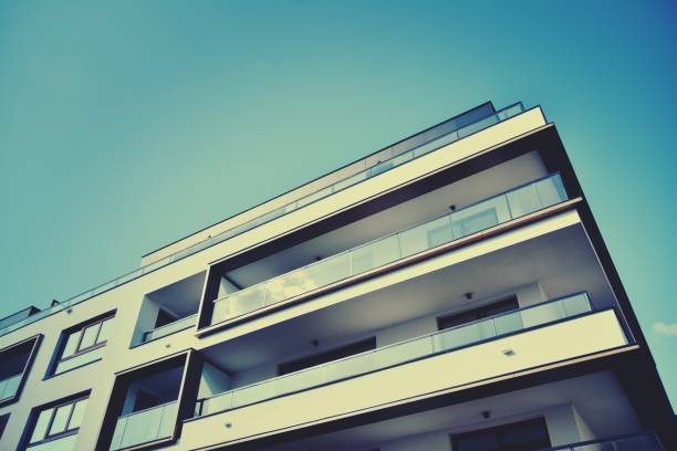 istock Modern apartment building exterior. Retro colors stylization 1158046928