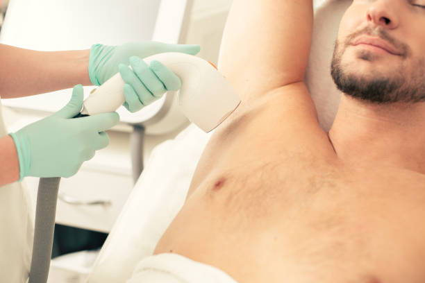 istock Underarm hair removal with special modern tool 1158046947