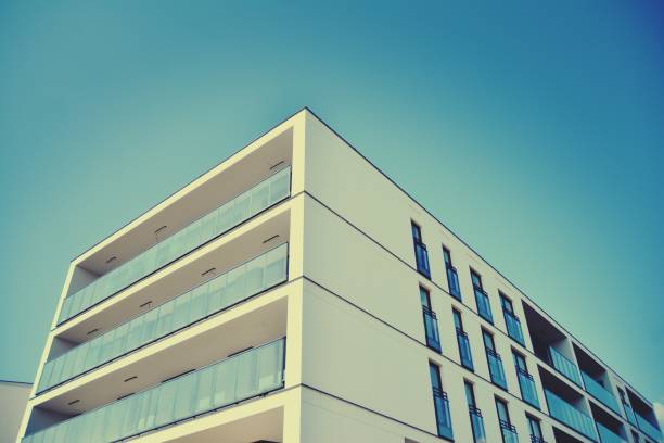 istock Modern apartment building exterior. Retro colors stylization 1158046985