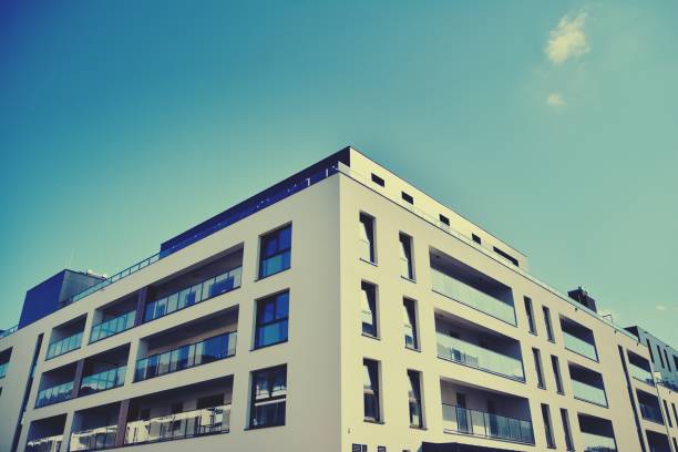 istock Modern apartment building exterior. Retro colors stylization 1158047010