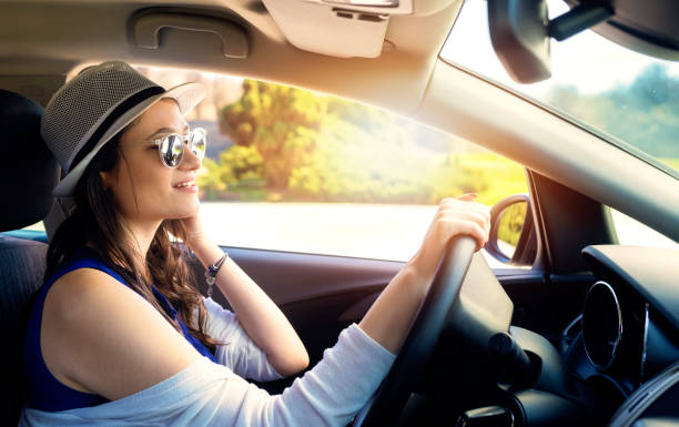 istock Happy young woman on road trip 1158048001