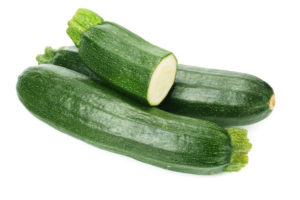 istock fresh green zucchini with slices isolated on white background 1158048747