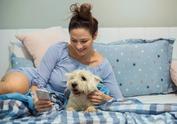 istock Young woman with dog 1158049278