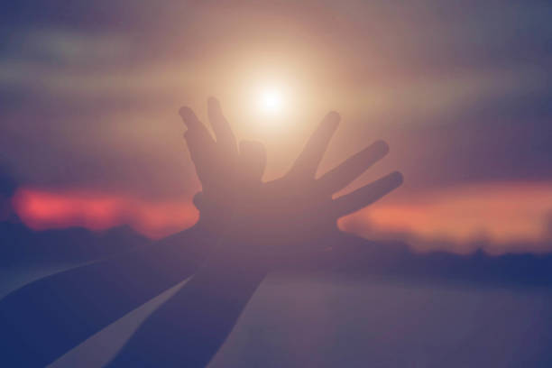 istock hands forming a heart shape with sunset silhouette 1158049825