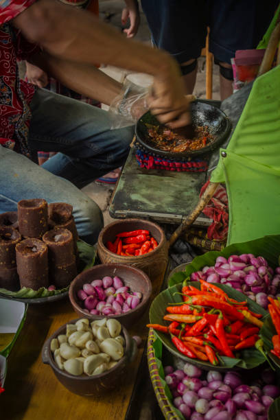 The seller is making special sambal for traditional fried tofu stock photo