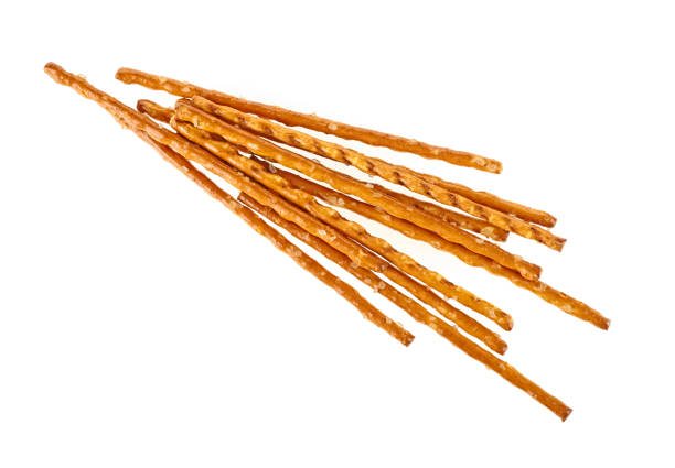 istock Bread sticks straws with salt on a white background. Salty snacks. 1158053662