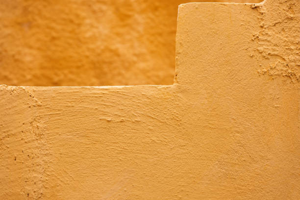ocher yellow wall texture grunge background, close up