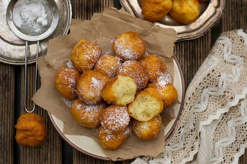 Homemade deep fried sweet ricotta fritters with powdered sugar
