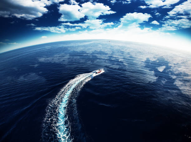 Boat in the Sea Aerial view on the sea and boat. Beautiful blue seascape at the summer time fast boat stock pictures, royalty-free photos & images