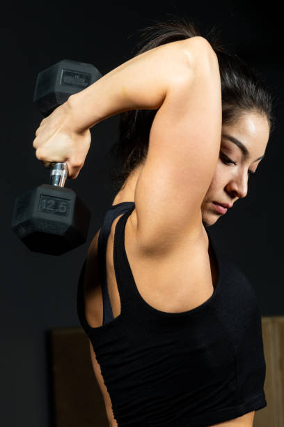 istock Hispanic young fitness female instructor exercising 1158059475