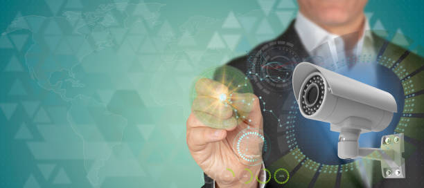 istock Security industry concept. Businessman pointing 3D CCTV camera object with pen in HUD design technological background with copy space 1158061271