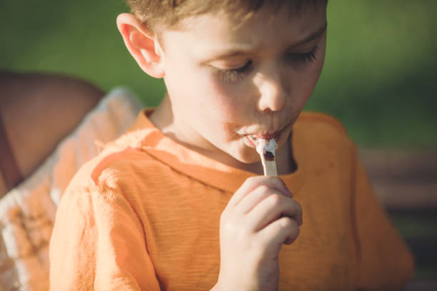 istock Mother and her son having fun with ice cream and hugging 1158061665
