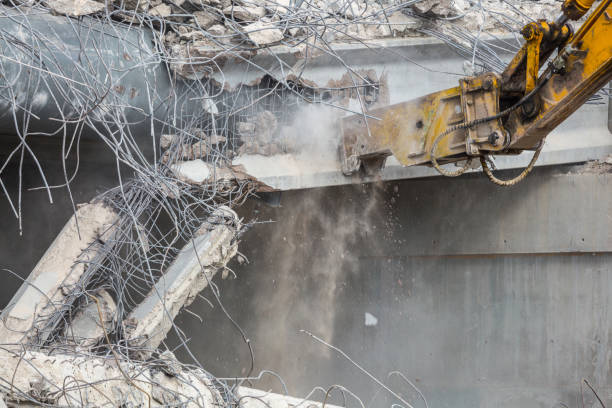 istock Professional demolition of reinforced concrete structures using industrial hydraulic hammer. Rods of metal fittings. Wreckage and crumbles of concrete. 1158061857