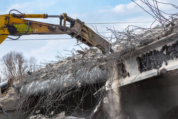 istock Professional demolition of reinforced concrete structures using industrial hydraulic hammer. Rods of metal fittings. Wreckage and crumbles of concrete. 1158061858