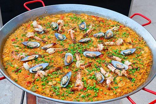 Spanish paella live cooking station, delicacy from  Spain