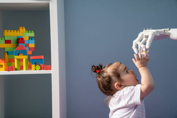 istock Humanoid Robotic Hand Giving Pacifier To Baby 1158066622