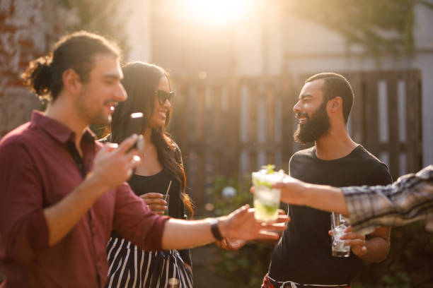 istock Friends having premium cocktails in a rooftop at sunset 1158067008