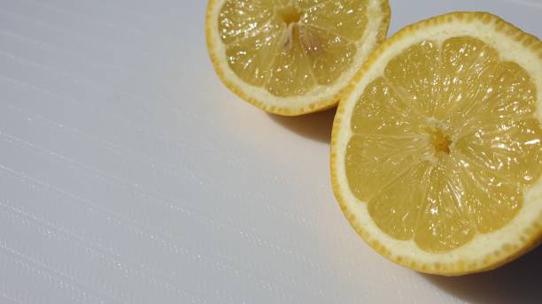 istock Slices of lemon on white background 1158068077