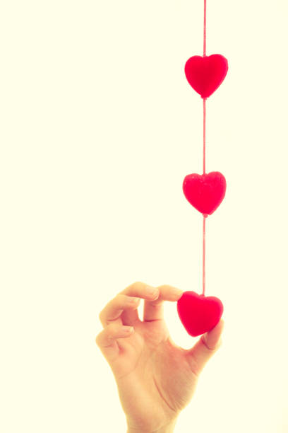 istock Female hand with little hearts. 1158068276