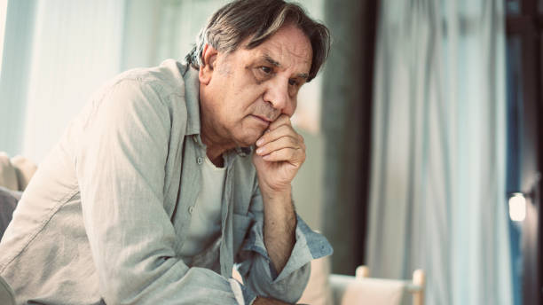 istock Portrait of thoughtful senior man 1158069055