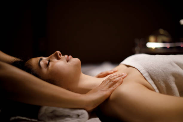 istock Woman enjoying massage in spa center 1158069571