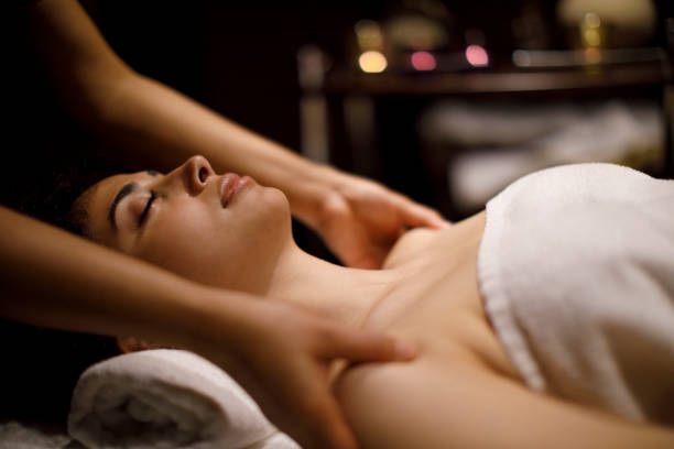 istock Woman enjoying massage in spa center 1158069575