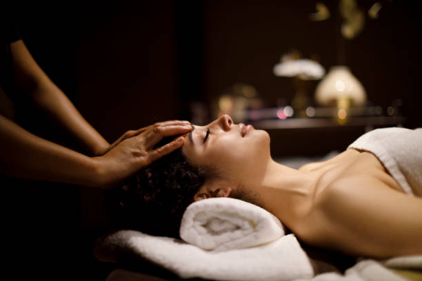 istock Woman enjoying head massage in spa center 1158069595