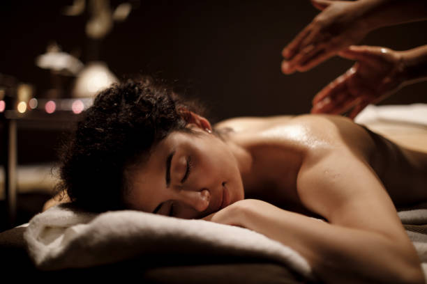 istock Woman enjoying massage in spa center 1158070151