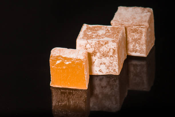 istock lokum Turkish delight, sweets on a black background (dessert sweets). food background. top view. copy space 1158070170